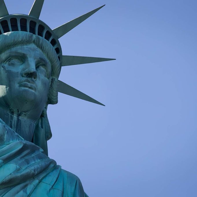 Statue of Liberty amongst blue sky