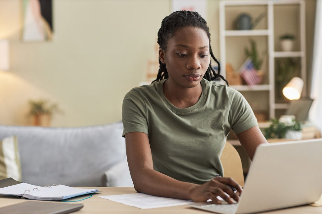 an active duty military woman logs into her online therapy session in Dallas Texas